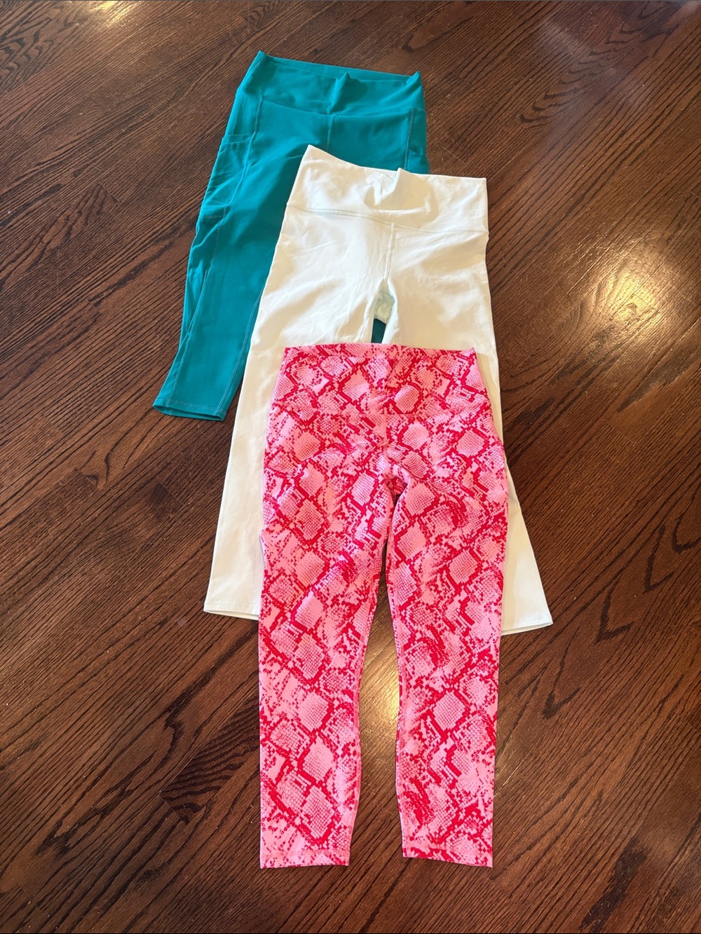 Fabletics Three-Pack Leggings in Pink Snake Print, Seafoam green, and Teal
